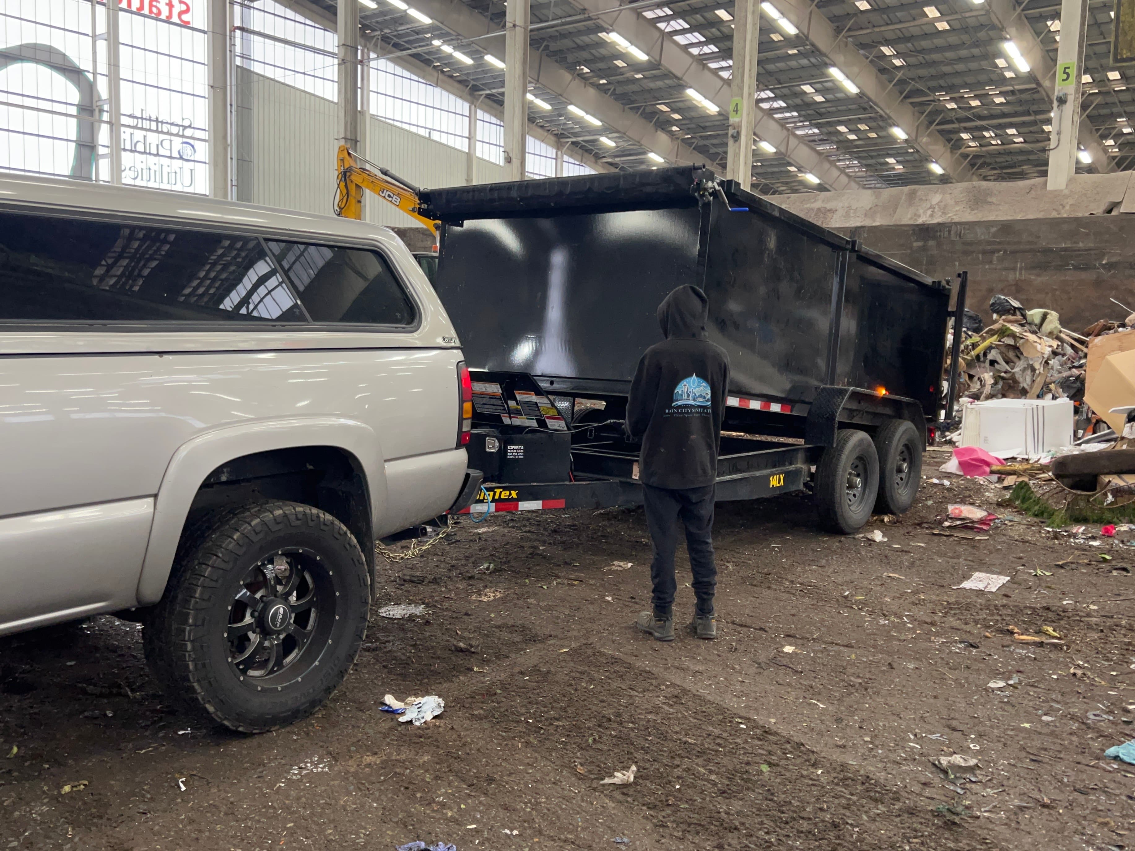 Rain City Sanitation truck and crew in action